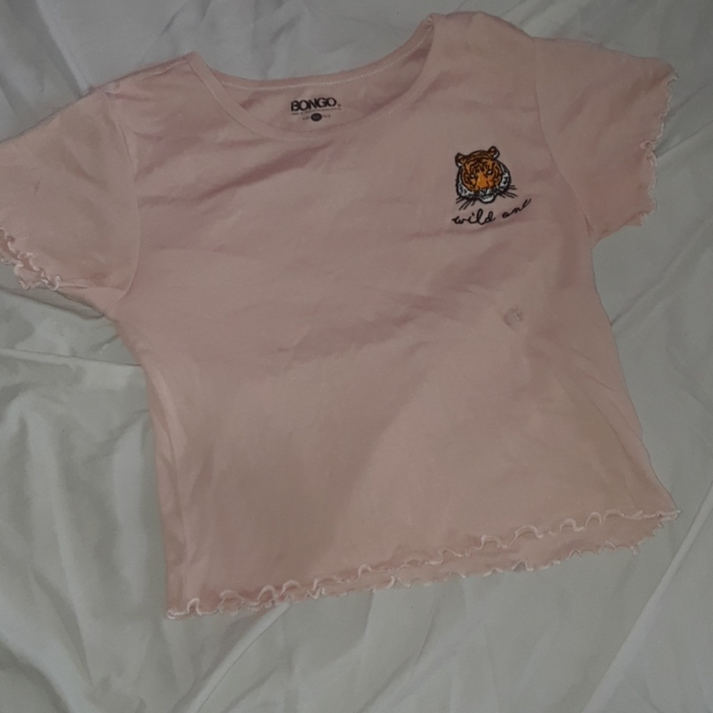 A rouchen crop top that is a salmon pink
